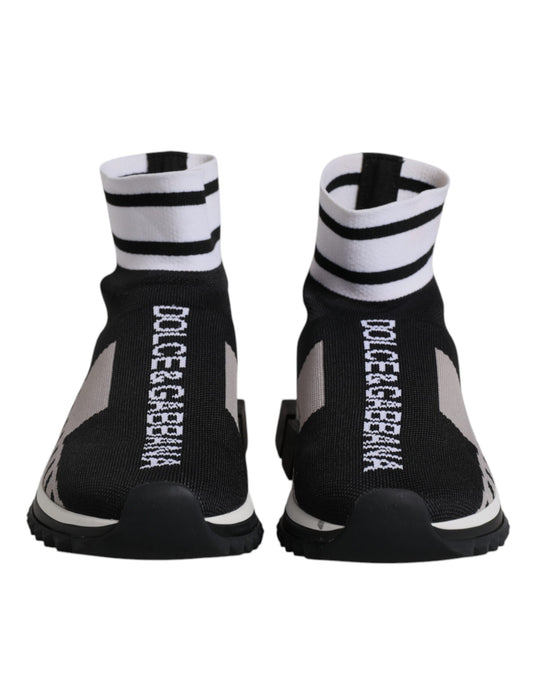 Dolce & Gabbana black and gray knit sock sneakers with white striped cuffs and white vertical logo text.