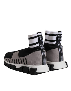 Dolce & Gabbana Sorrento slip-on sneakers in black and gray knit with white striped cuffs and chunky rubber soles.