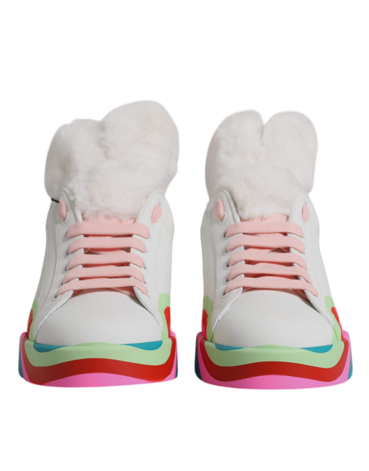 Dolce & Gabbana white leather sneakers with fuzzy plush lining, pink laces, and a wavy, multicolored rubber sole.