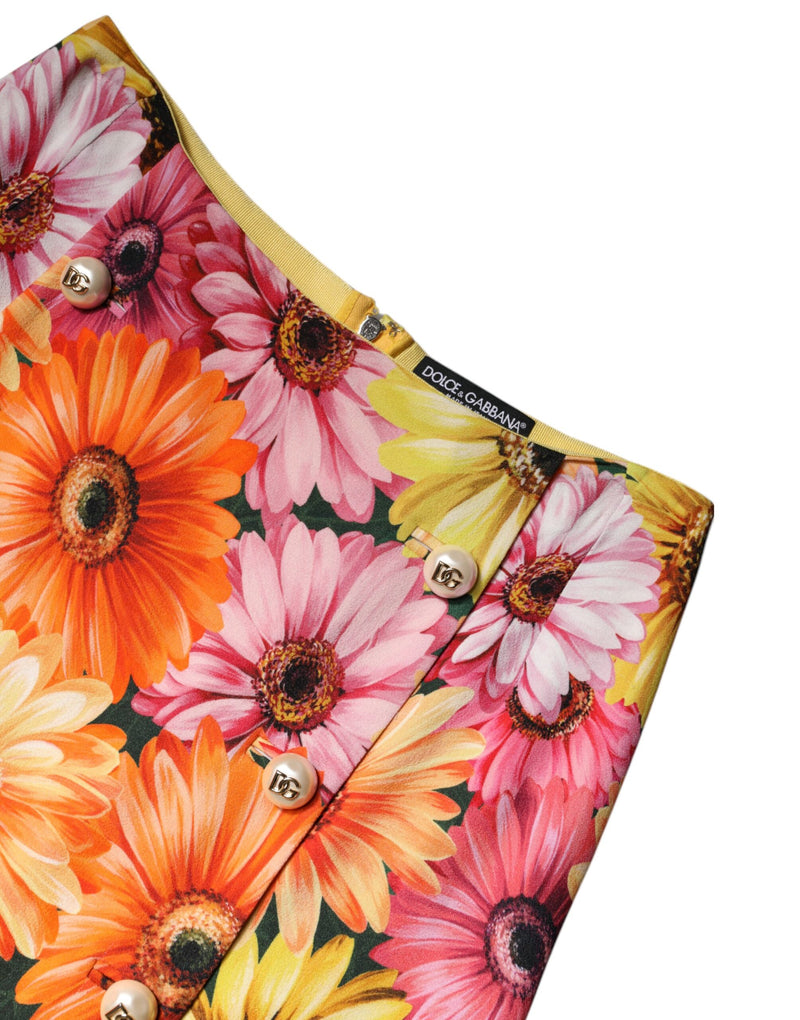 Dolce & Gabbana multicolor floral high waist mini skirt featuring pink, orange and yellow gerberas and pearl-like buttons