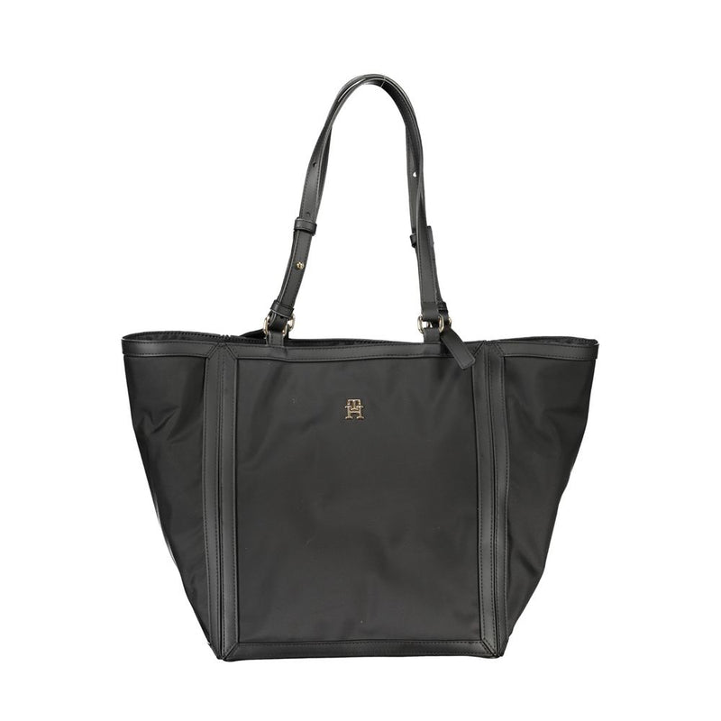 Black polyester women handbag with structured design, dual shoulder straps and metallic logo accent