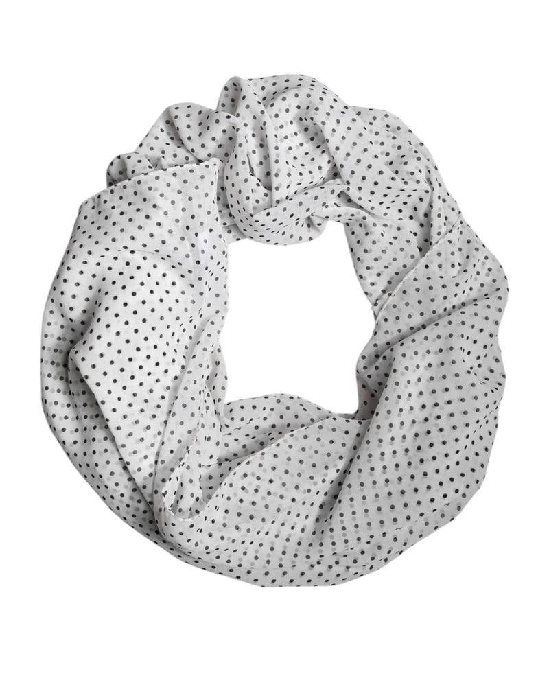 White polyester wrap scarf with black polka dots styled in a loop