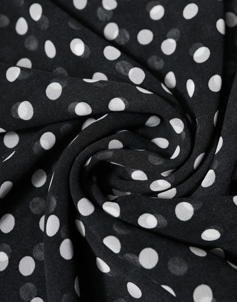 Black polyester wrap scarf with white polka dots gathered in soft folds