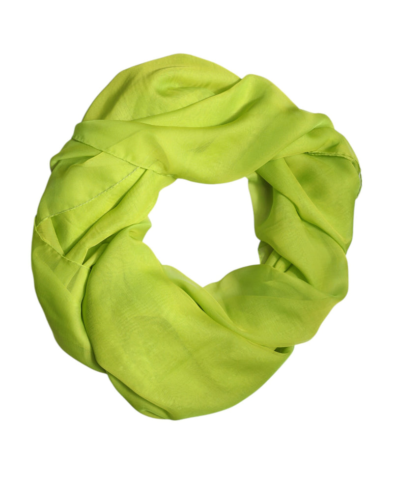Bright lime green silk infinity scarf coiled in a circle