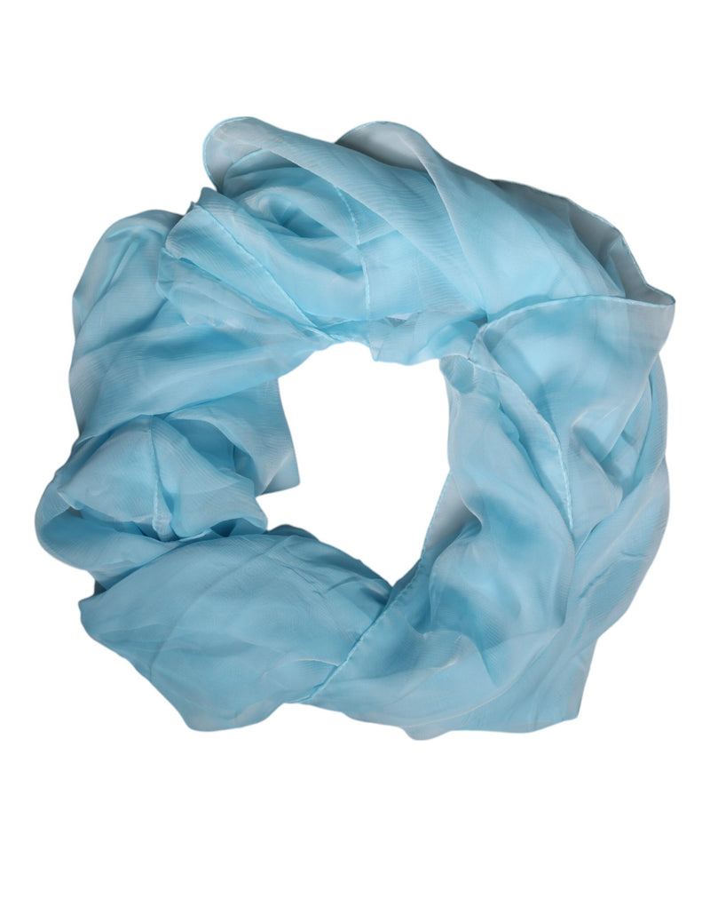 Light blue silk rectangle wrap scarf styled in a soft circle