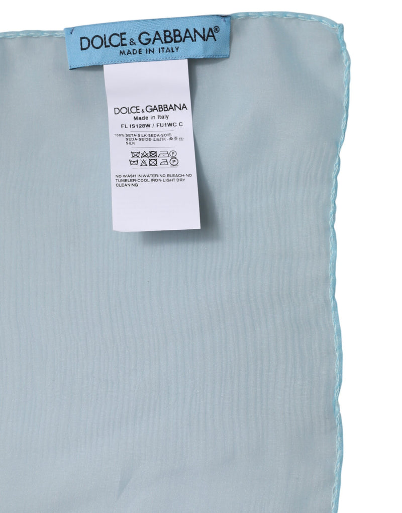 Light blue silk scarf with Dolce and Gabbana brand labels sewn on