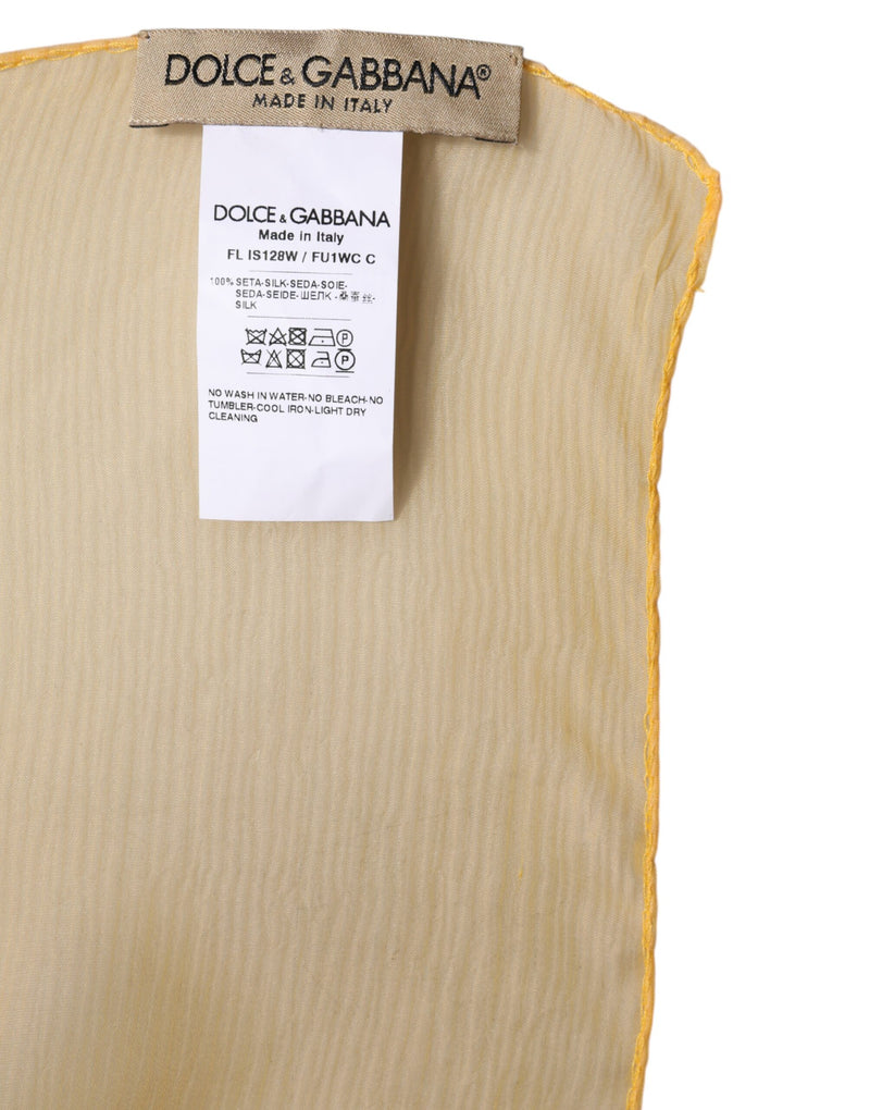 Dolce & Gabbana yellow silk wrap shawl scarf featuring a brand tag and care label