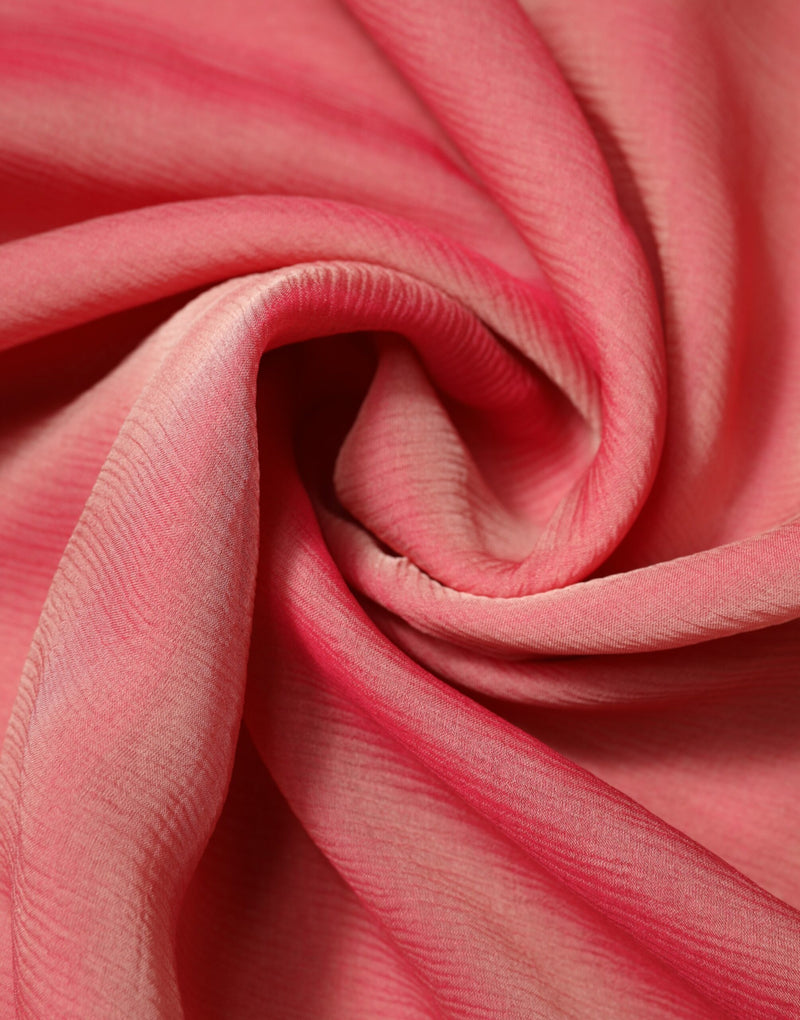Pink silk textured wrap scarf draped in soft folds