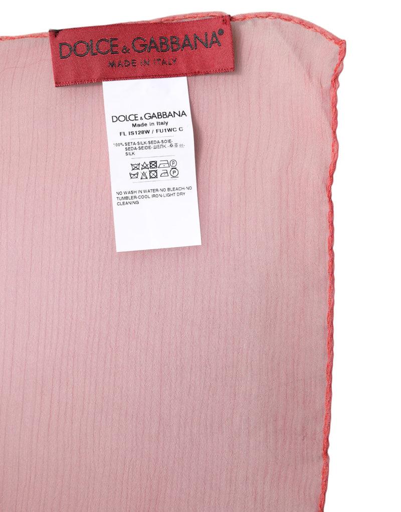 Pink silk scarf with Dolce and Gabbana brand label and care tag