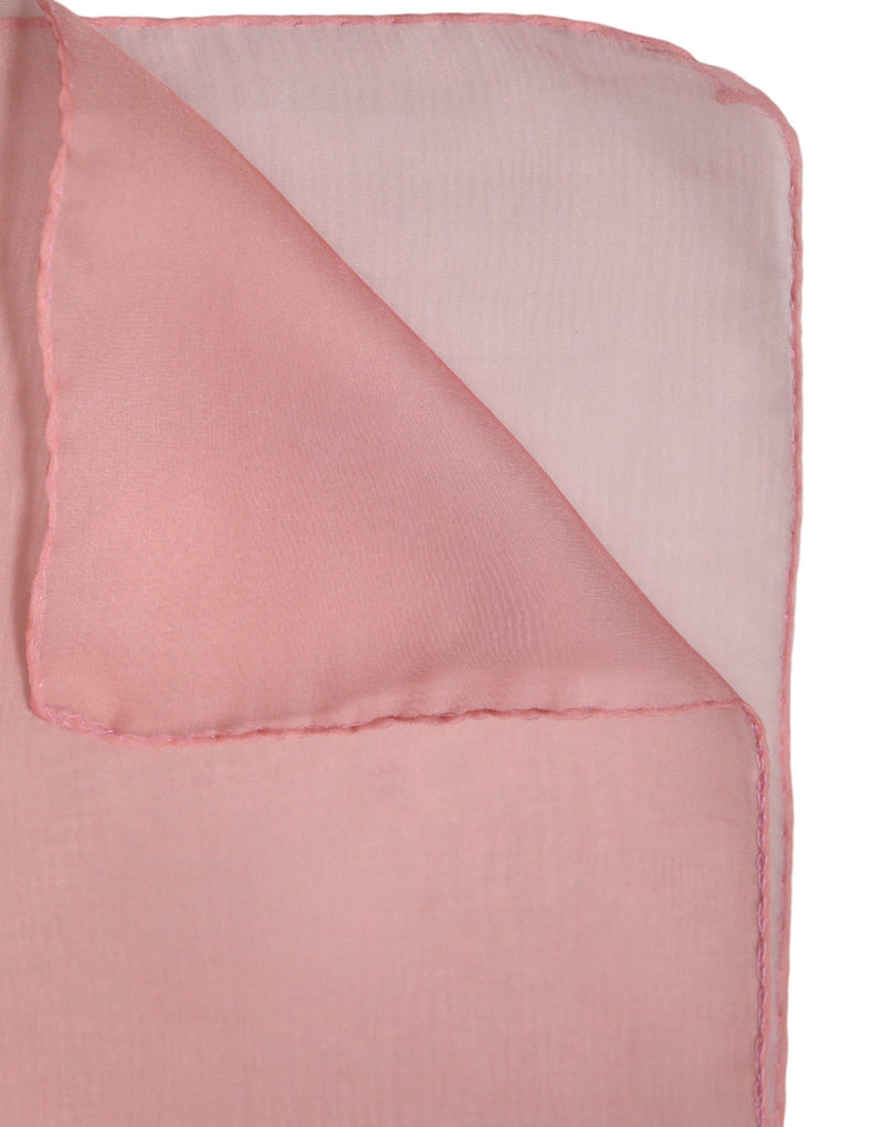 Pink silk wrap shawl scarf folded on a white background