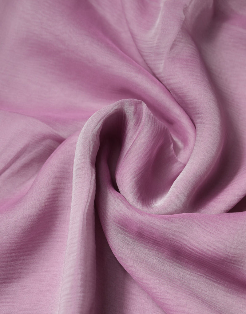 Soft pink silk scarf draped in gentle folds