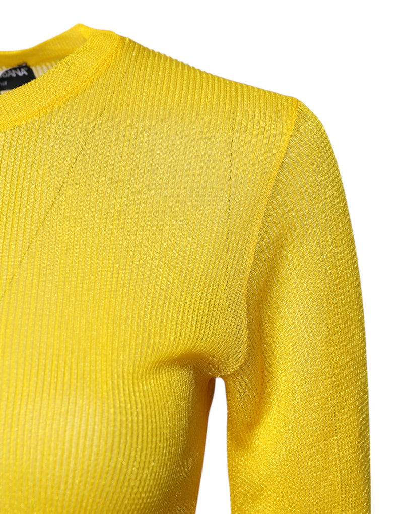 Close-up of a bright yellow ribbed knit pullover sweater with long sleeves and a round neckline