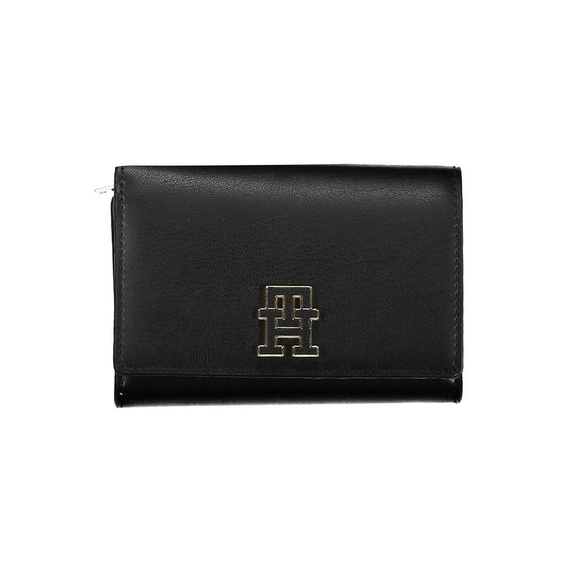 Black polyurethane trifold women's wallet with a gold metal Tommy Hilfiger logo on the front