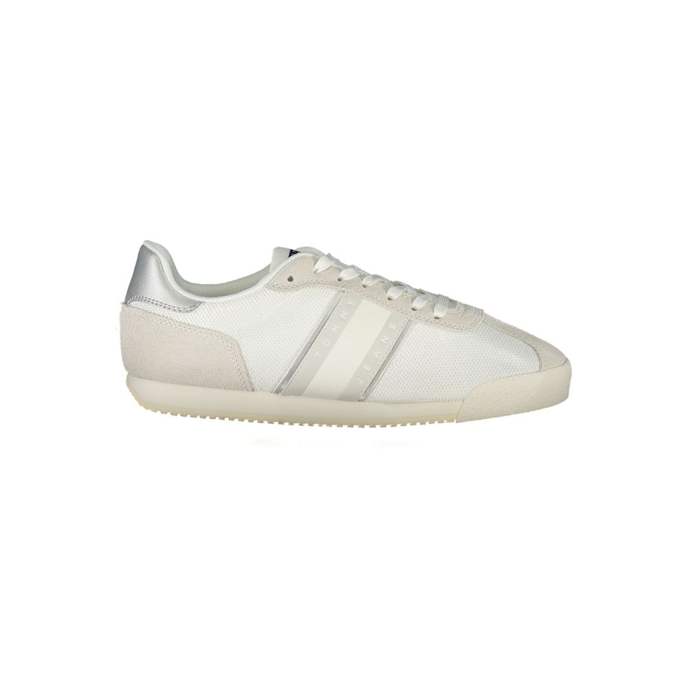 Tommy Hilfiger women's white polyester and suede sneaker with a silver heel detail and a sporty, low-top silhouette.