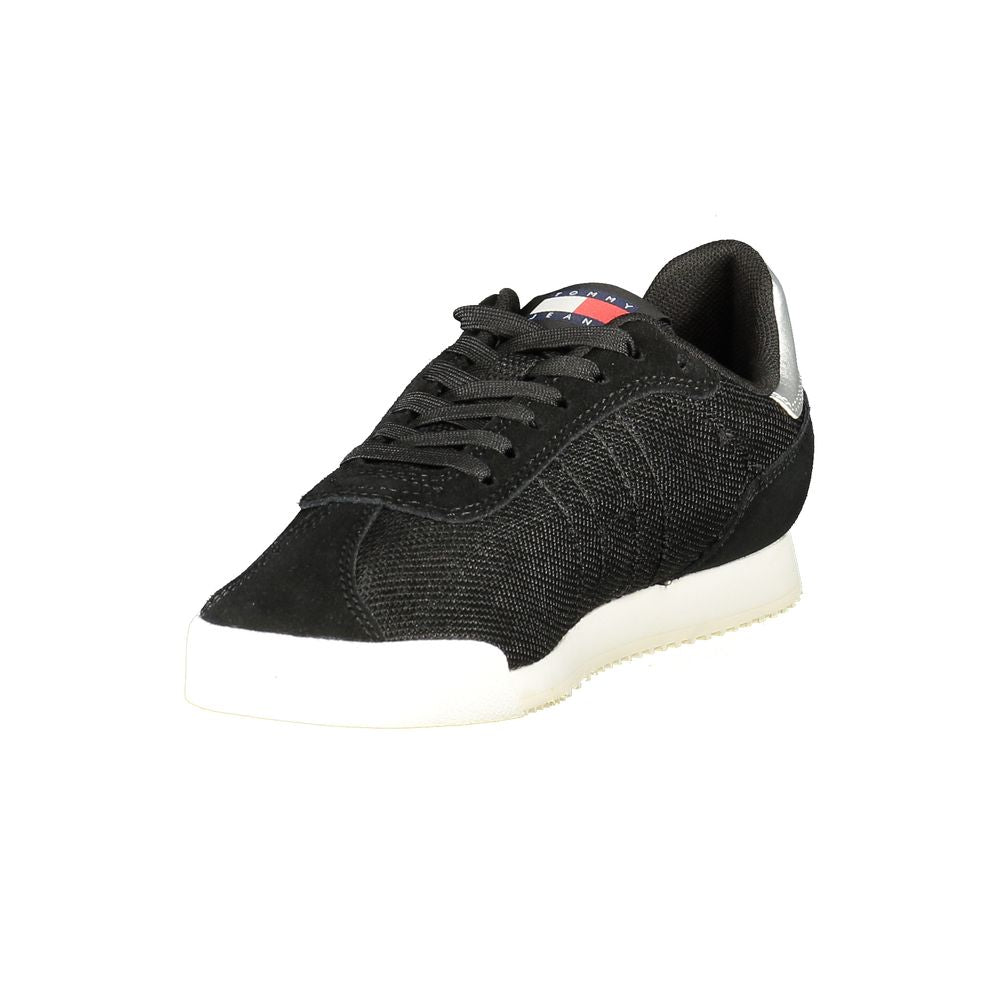 Tommy Hilfiger black polyester women's sneaker with lace-up closure, silver heel tab, and white rubber sole.