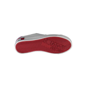 Tommy Hilfiger white leather women's sneaker with a red rubber sole featuring the Tommy Jeans logo.