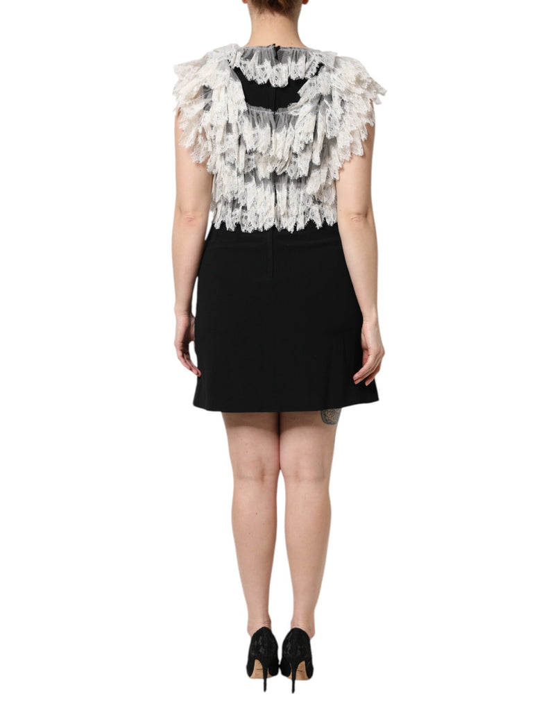 Black mini dress with layered white lace ruffled shoulders and bodice