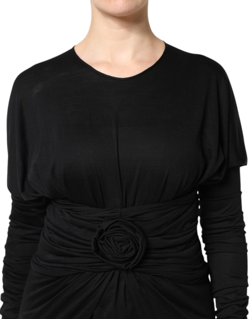Black wool long sleeve sheath midi dress with draped waist and fabric rose detail