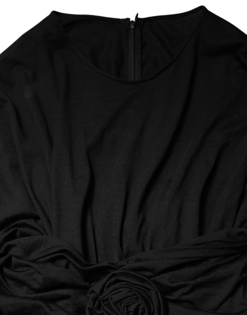 Black wool long sleeves sheath midi dress featuring a round neckline and back zipper closure