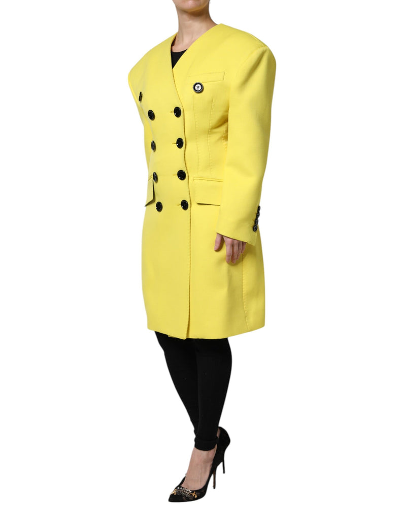 Bright yellow double-breasted wool trench coat with large black buttons and structured shoulders