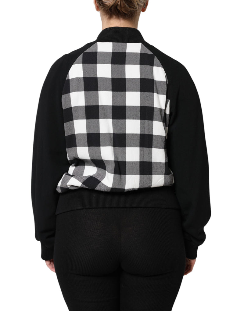 Black bomber jacket with a white and black checkered back panel