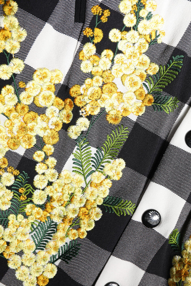 Black and white check jacket with yellow floral embroidery and black buttons