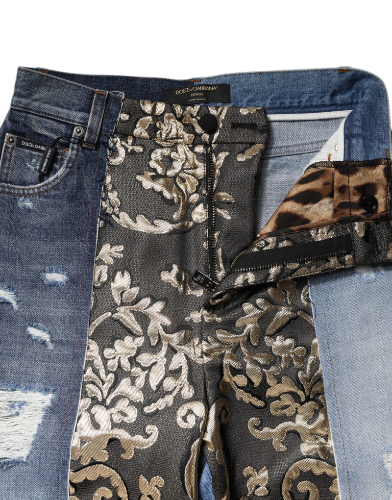 Multicolor patchwork denim jeans featuring distressed blue denim and a gold damask fabric center panel