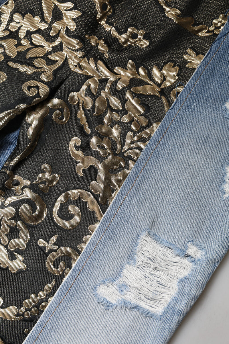 Multicolor patchwork denim jeans featuring distressed blue denim and black fabric with metallic gold floral brocade