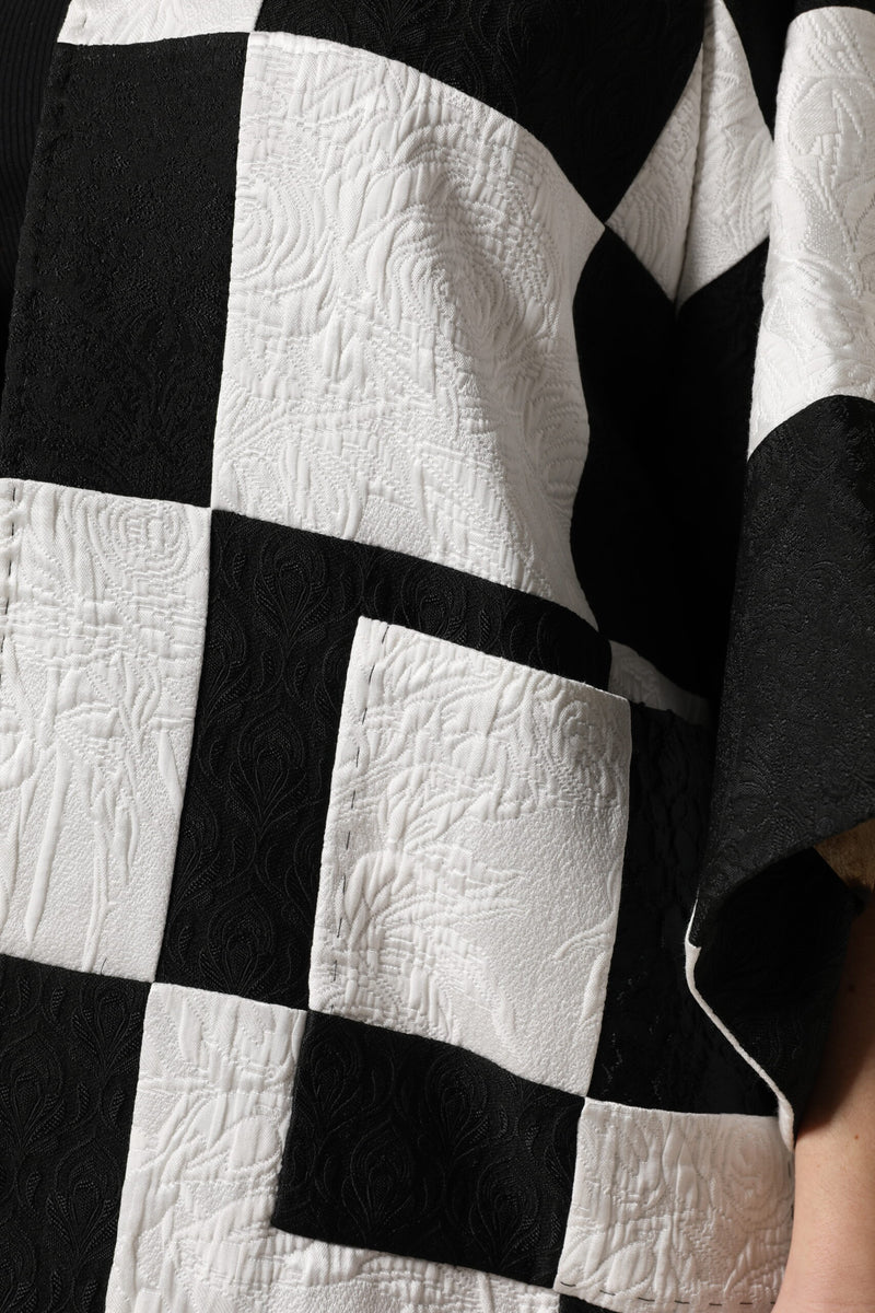 Black and white patchwork jacquard blazer with textured floral patterns
