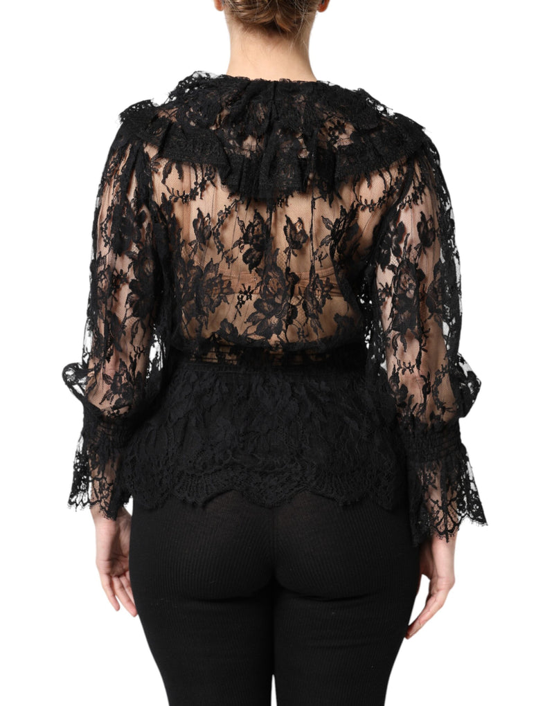 Back view of a black floral lace blouse featuring long sleeves and ruffled details