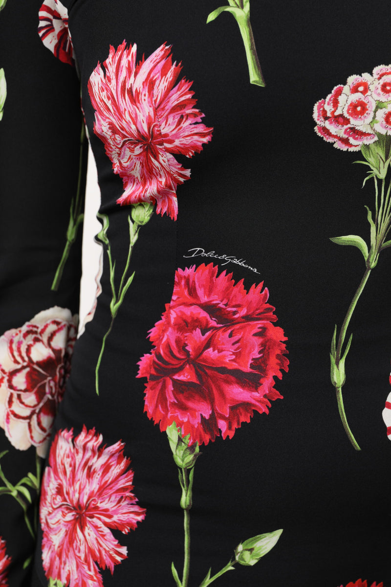 Dolce & Gabbana black long sleeve top featuring a vibrant red and white carnation floral print