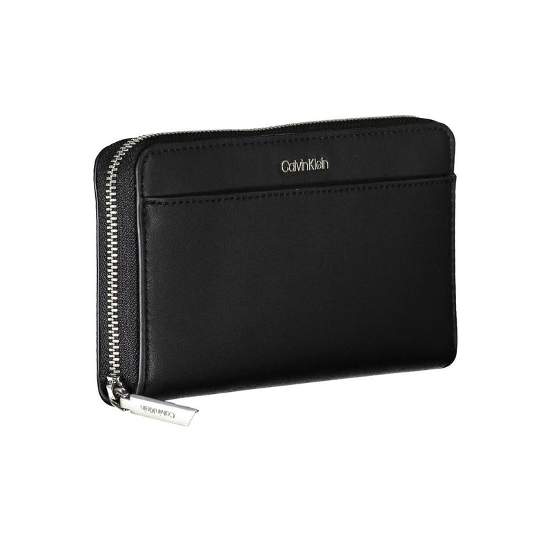 Black faux leather Calvin Klein zip-around women's wallet with silver logo lettering