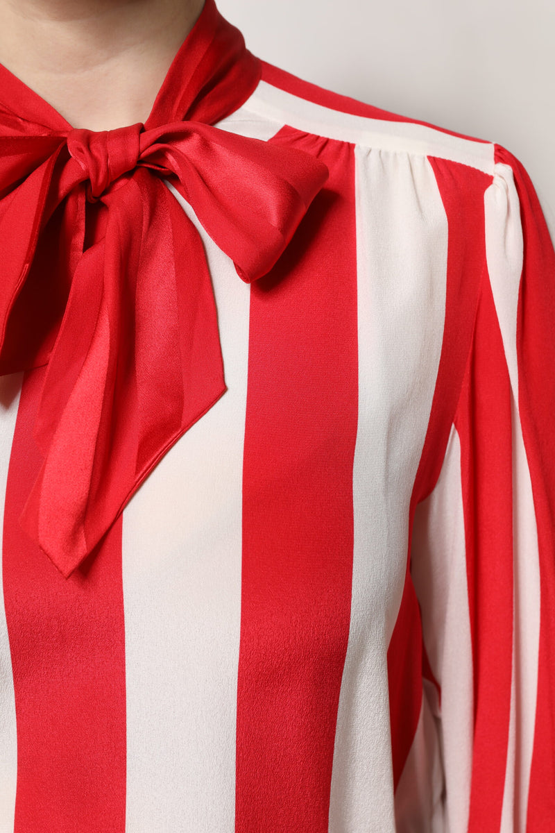 Red and white striped silk blouse with an ascot collar tied in a bow