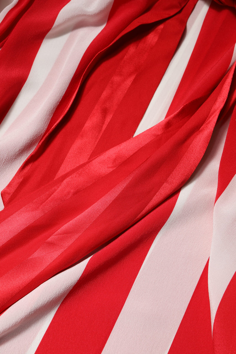 Close up of red and white striped silky ascot blouse fabric