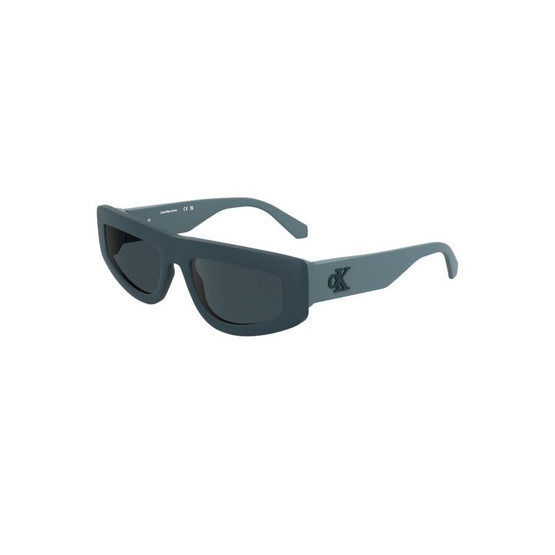 Matte blue-grey bio-acetate sunglasses with thick frames, dark lenses, and a Calvin Klein logo on the temple