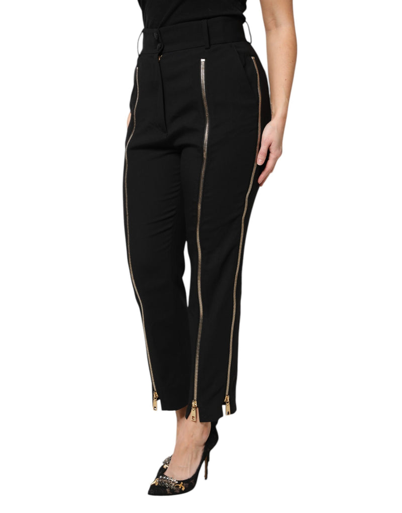 Black wool high-waist tapered pants with prominent front and side zippers