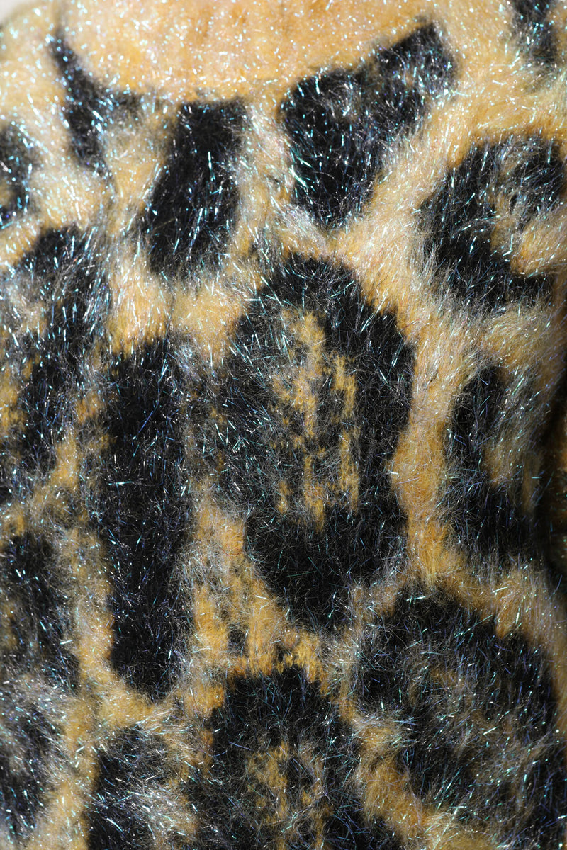 Multicolor leopard print fuzzy mohair crew neck sweater fabric close up