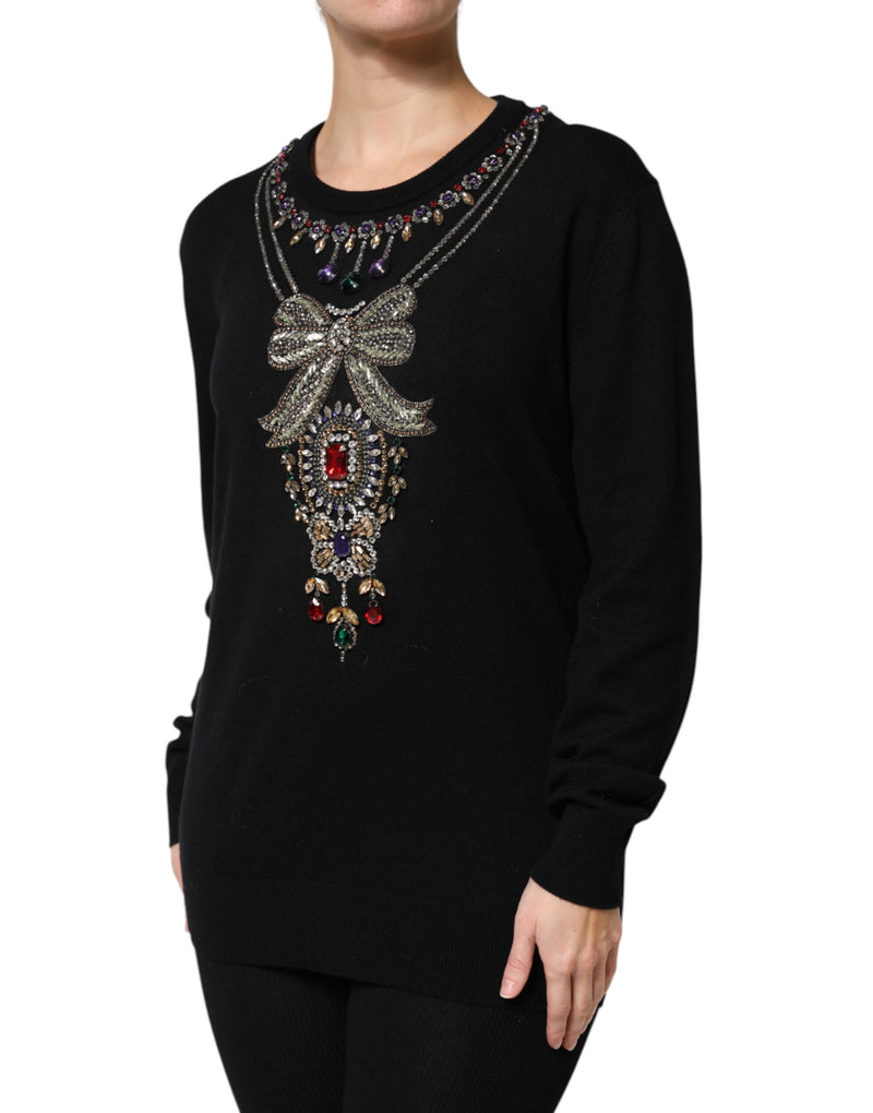 Black cashmere crewneck sweater with crystal and jewel embellishments in a necklace and bow design