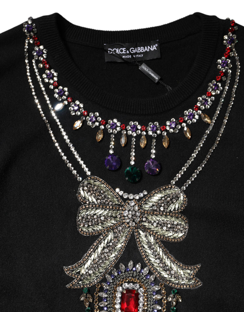 Black cashmere sweater with colorful crystal beaded necklace and bow embellishments