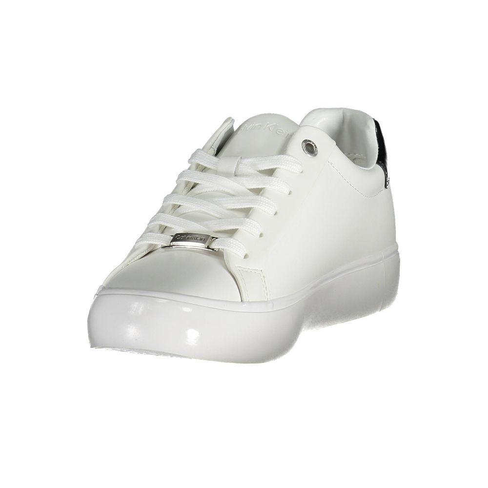 Calvin Klein white leather sneaker with lace-up closure, metallic branded hardware, and black heel accent.