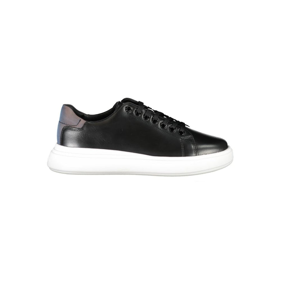 Calvin Klein women’s black leather sneaker with a thick white platform sole and iridescent heel detail.