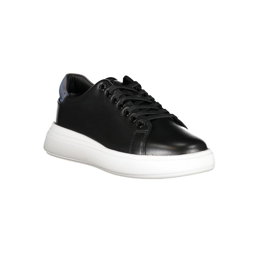 Calvin Klein black leather low-top women's sneaker with black laces, metal eyelets, and a thick white platform sole.