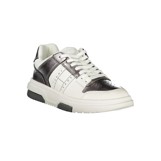 Tommy Hilfiger women’s polyurethane sneaker in white and metallic silver, featuring a chunky casual lace-up style.