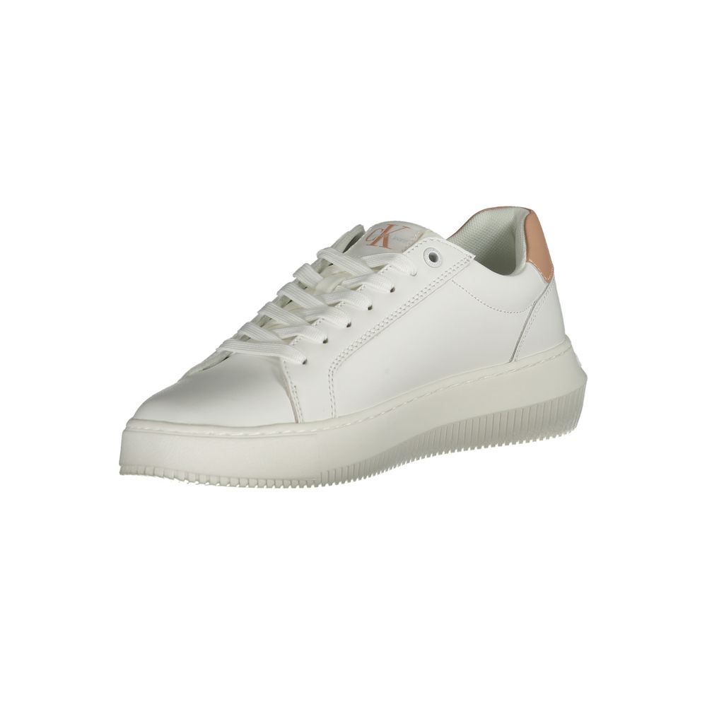 Calvin Klein white leather sneaker with lace-up closure, thick rubber sole, and tan heel accent.