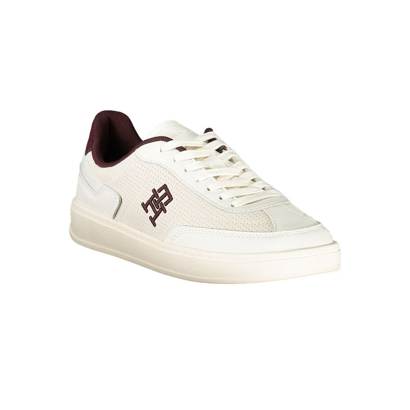 Tommy Hilfiger beige polyurethane women's sneaker with lace-up closure and maroon logo detail on a white background.