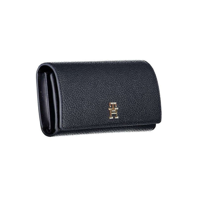Dark blue textured polyurethane folding women's wallet with a gold logo on the front flap
