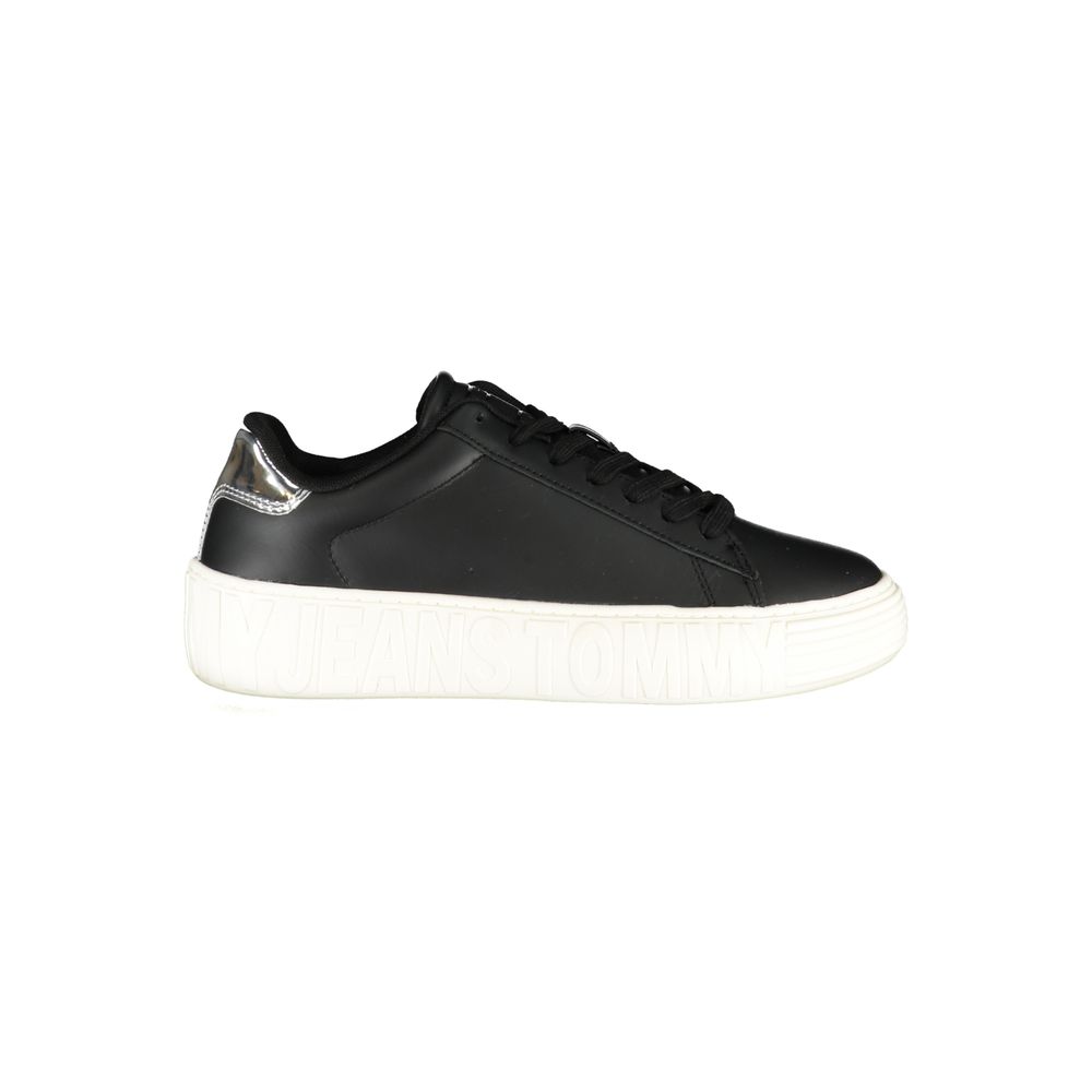 Tommy Hilfiger black leather women's sneaker with silver heel detail and chunky white embossed platform sole.