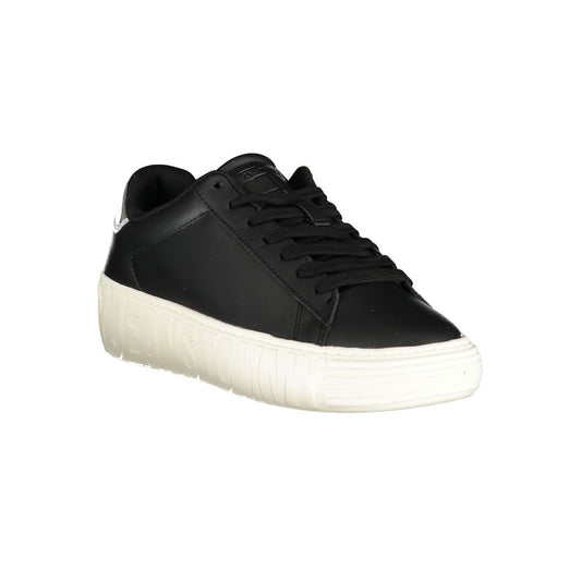 Tommy Hilfiger black leather women’s low-top sneaker with a thick, textured white platform sole.