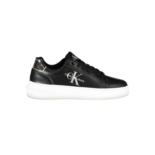 Calvin Klein black leather women’s sneaker with white logo, laces, and sole, plus a metallic silver heel accent.