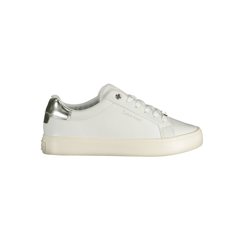 Calvin Klein white leather sneaker with a silver metallic heel tab and a thick, cream-colored rubber sole.